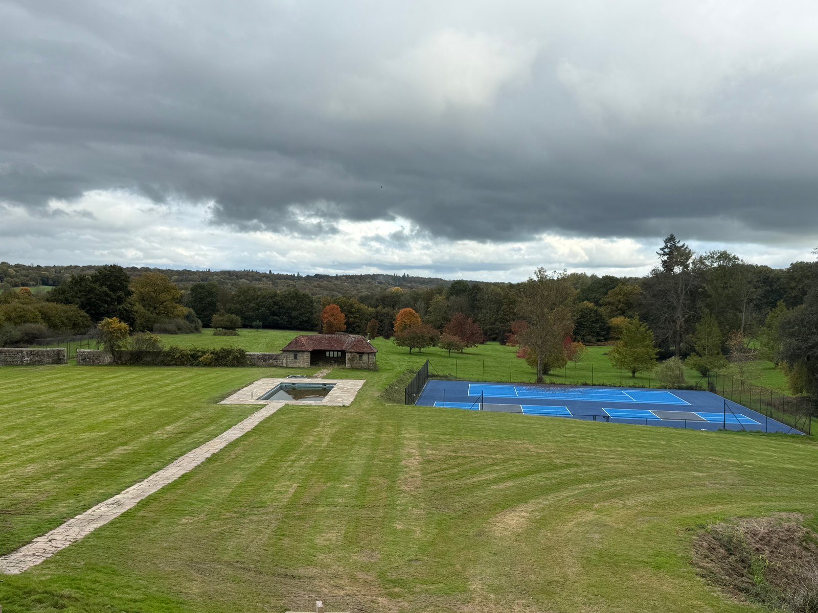 Pool and tennis court at The Homestall Manor